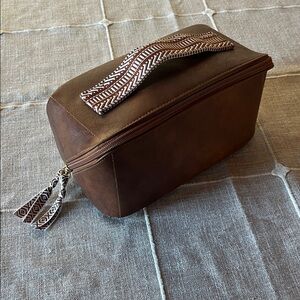 Elegant Brown Toiletry Bag with Patterned Handle